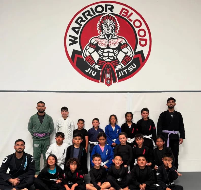 WBJJ kids training jiu jitsu on the mats