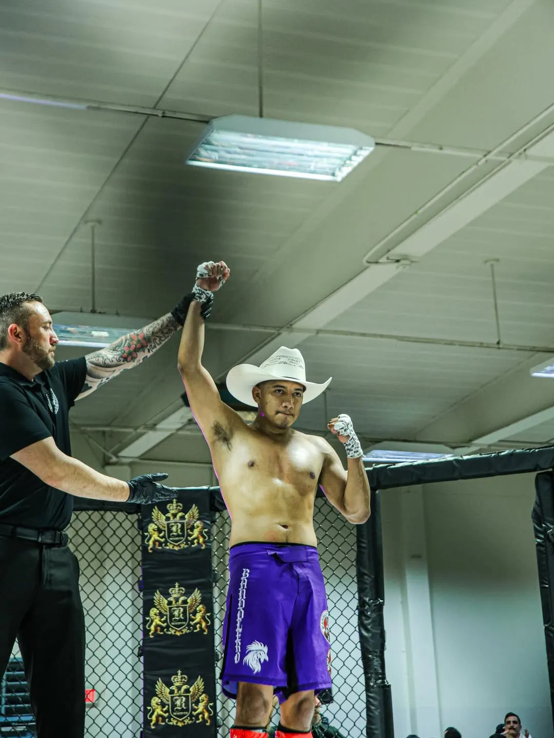 Javi celebrating a victory in the cage